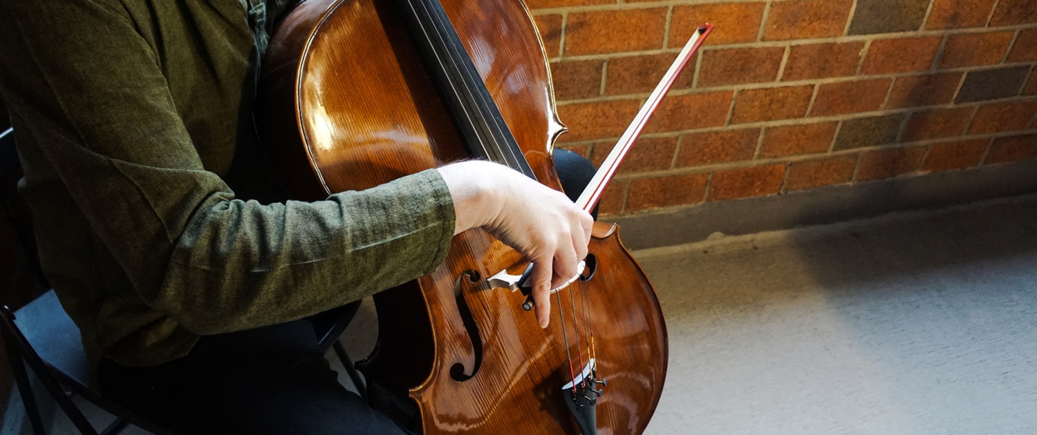 Close up of person playing the cello